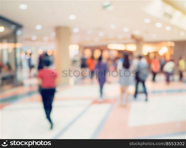 Blurred image background, people at shopping mall blur background with bokeh and vintage tone.