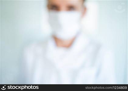 blurred image of a doctor wearing mask