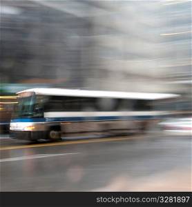 Blurred image of a transit bus in Manhattan, New York City, U.S.A.