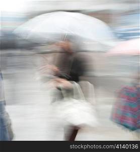 Blurred image of a woman holding an umbrella, Ginza, Chuo Ward, Tokyo, Japan