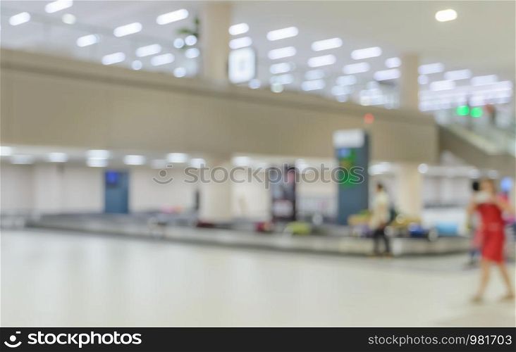 Blurred image of baggage carousel in airport arrival terminal