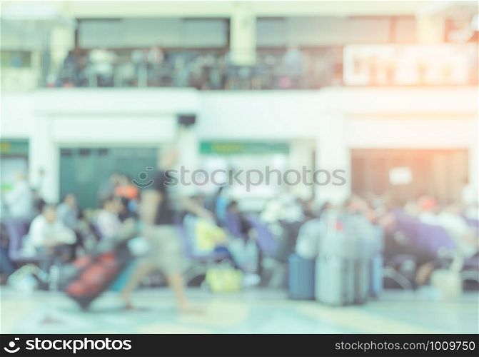 Blurred image of crowed passengers at terminal or station waiting for train, bus and other public transport