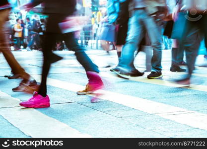 Blurred image of people moving in crowded city street. Art toning abstract urban background. Hong Kong