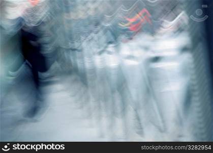Blurred image of person walking.
