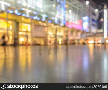 Blurred image of shopping mall with shining lights at night