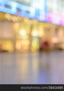Blurred image of shopping mall with shining lights at night