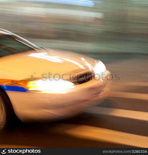 Blurred image of the front of a car on the streets of Manhattan, New York City, U.S.A.