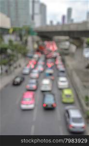 Blurred image of traffic jam in rush hour cars of Bangkok business area downtown - Real life transportation concept