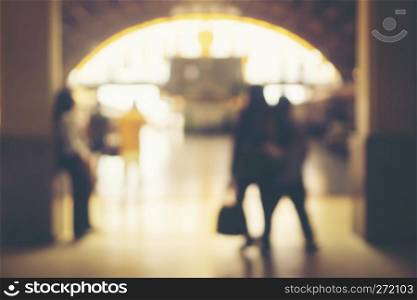 Blurred images of people in the train station