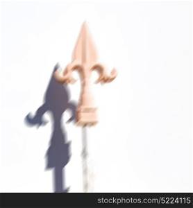 blurred in iran wall and shadow of a metal fence for the home security like symbol
