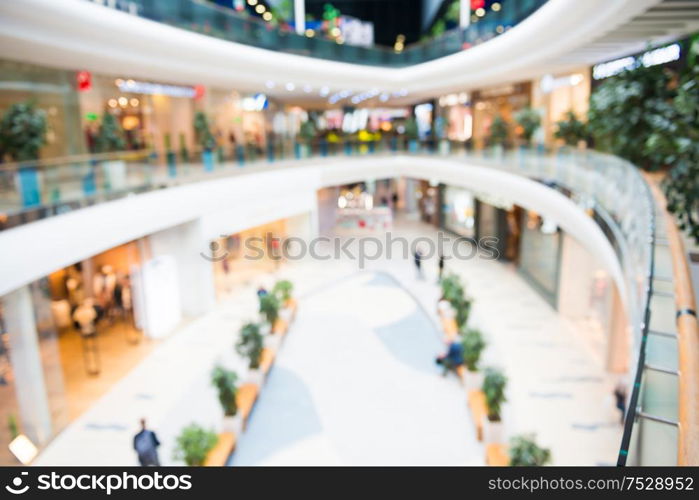 Blurred interior of luxury mall or shoppin center