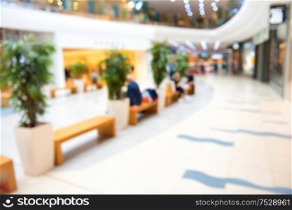 Blurred interior of luxury mall or shoppin center