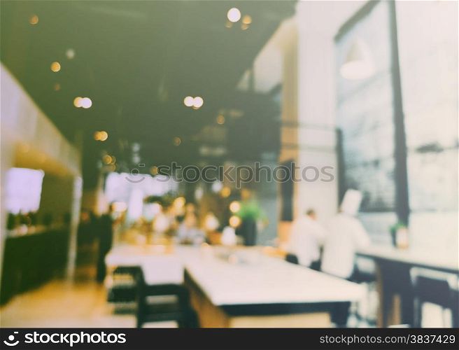 Blurred interior of restaurant with vintage filter effect