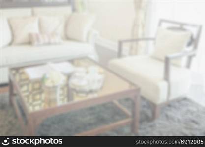blurred living room interior with set of elegant teacup for background