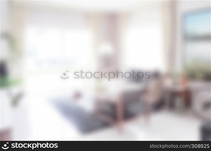 Blurred living room with dining table in modern interior