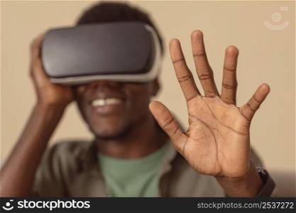blurred man wearing virtual reality headset