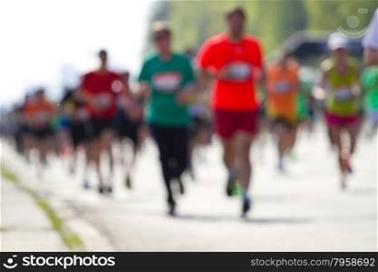 Blurred mass people of marathon runners