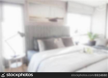 Blurred modern bedroom with bed for background