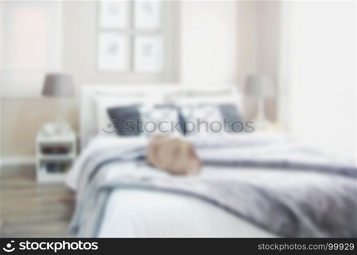 blurred modern bedroom with white bed