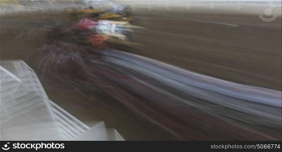Blurred motion of chuckwagon racing at the annual Calgary Stampede, Calgary, Alberta, Canada