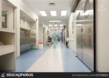 Blurred motion of doctor walking in a hospital corridor