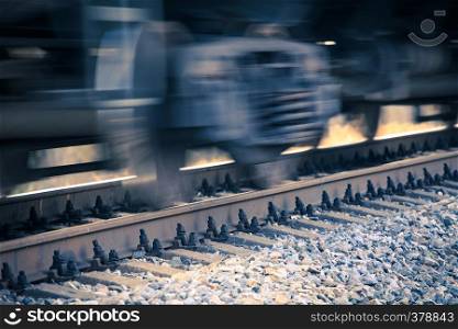 blurred motion of spinning train wheels close up