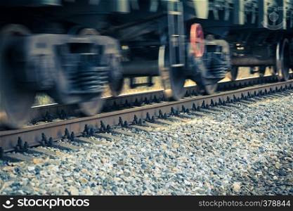 blurred motion of spinning train wheels close up