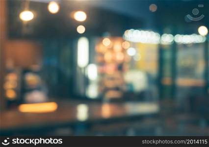 Blurred of coffee shop and restaurant with bokeh coloful night lights background