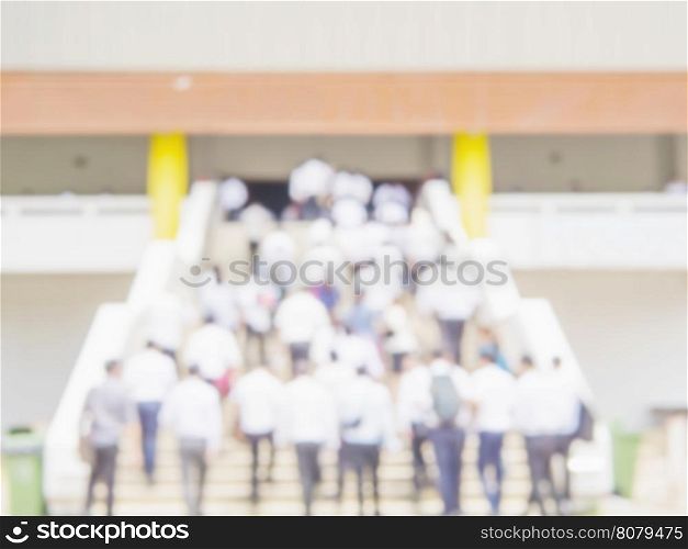 Blurred photo of crowded student is walking upstair to the examination hall