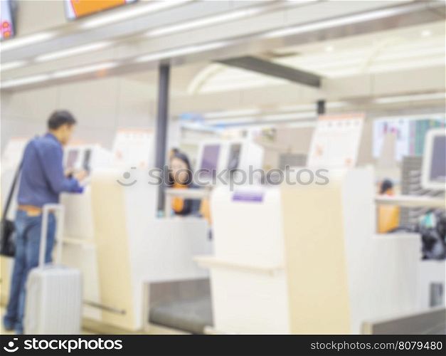 Blurred photo of passenger is checking in at the airport terminal