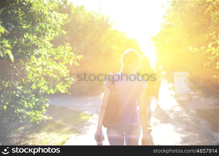 Blurred photo of walking woman on sunrise. walking woman on sunrise