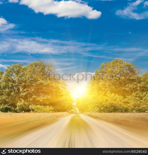 Blurred road nature background. Blurred road. Non-urban summer landscape nature background. Blurred road nature background