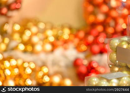 Blurred sparkling red and golden Christmas bulbs