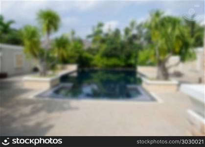 blurred swimming pool beautiful in tropical resort for background.. blurred Swimming pool
