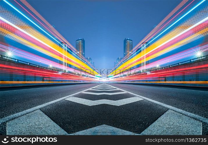 blurred traffic light trails on road at night in China.. blurred traffic light trails on road