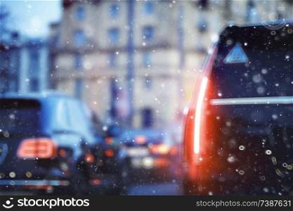 blurred transport background snow / traffic on a winter highway, seasonal auto concept, blurry auto texture, traffic jams