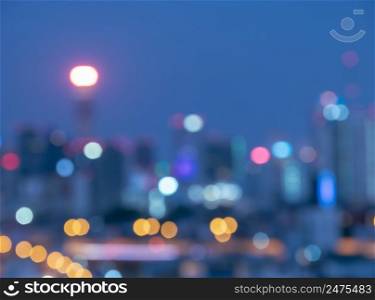 Blurred twilight bokeh lights city office building, abstract background