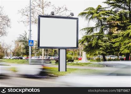 blurred vehicle passing by blank billboard road. High resolution photo. blurred vehicle passing by blank billboard road. High quality photo