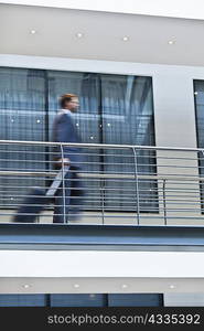 Blurred view of businessman on balcony