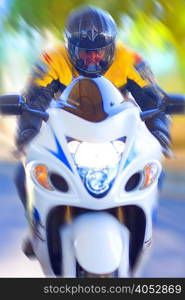 Blurred view of man riding motorcycle