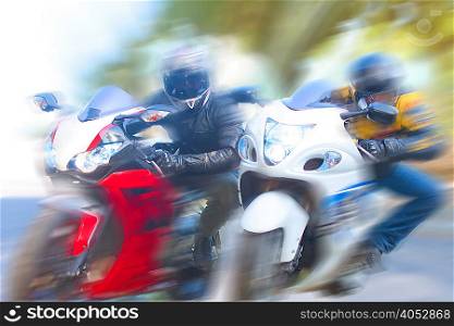 Blurred view of men riding motorcycles