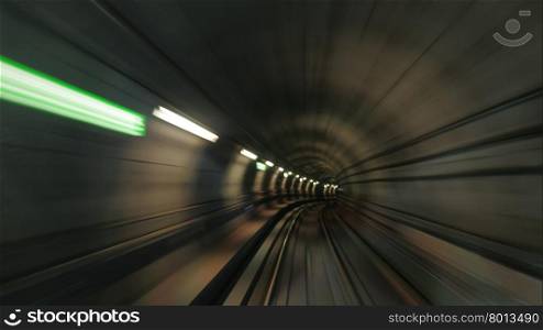 Blurred view on subway tunnel in motion. Subway tunnel in motion