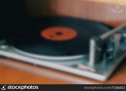 Blurred vintage vinyl player in house