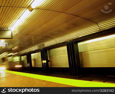 Blurring transit subway train.