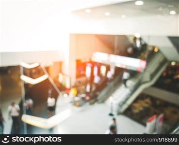 Blurry background of department store with crowd people in convention hall. Abstract concept. Business marketing and event theme.