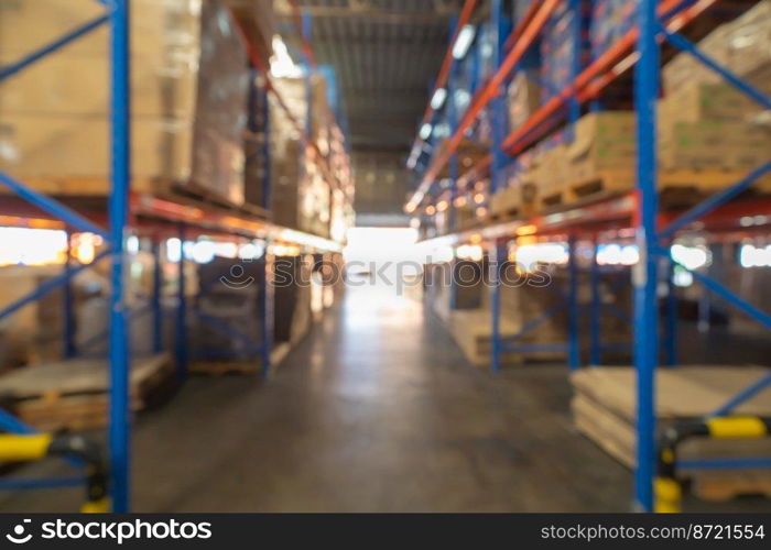 Blurry bokeh abstract background of interior of large warehouse retail store industry. Rack of furniture and home accessories stock storage. Interior of cargo in ecommerce and logistic concept. Depot