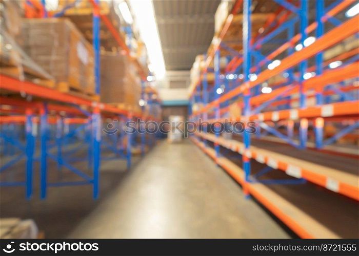 Blurry bokeh abstract background of interior of large warehouse retail store industry. Rack of furniture and home accessories stock storage. Interior of cargo in ecommerce and logistic concept. Depot