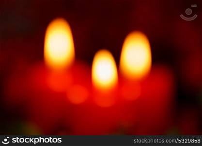 Blurry Christmas candles in red. Decoration for holidays