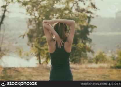 Blurry of Athletic woman asian warming up and Young female athlete sitting on an exercising and stretching in a park before Runner outdoors, healthy lifestyle concept,soft focus