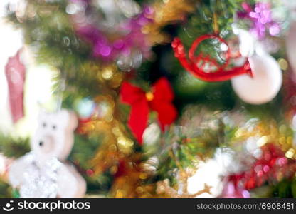 blurry photo of christmas tree with various christmas decorated